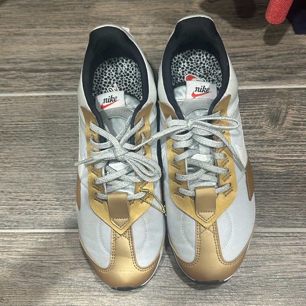 Women’s Gold/Silver Nike shoes